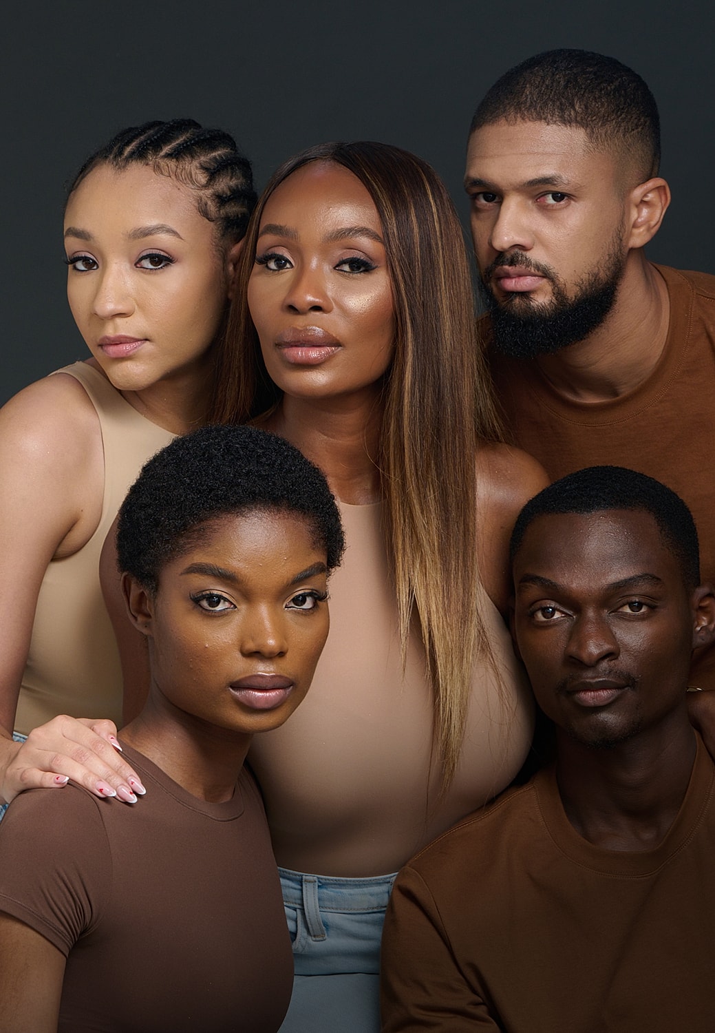 Diverse group of people posing together artistically.