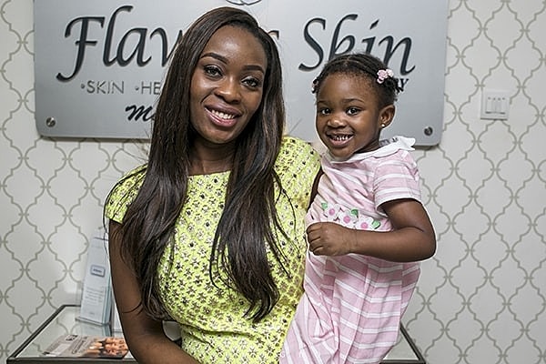 Mother and daughter smiling at spa.