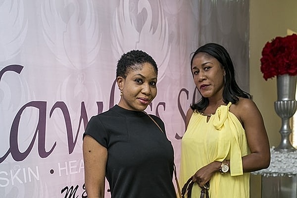Two women posing at an event.