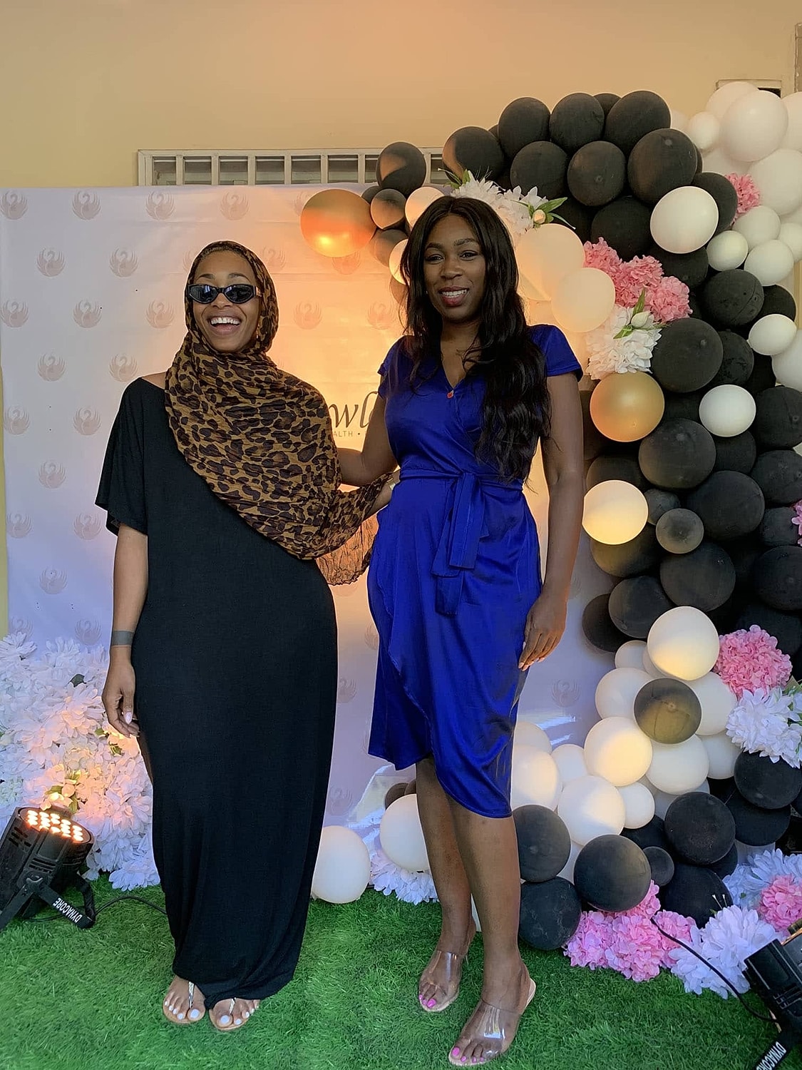 Two women posing together at an event.