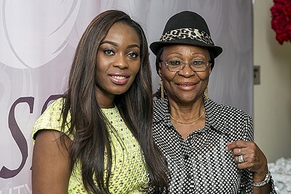 Two women smiling together at an event.