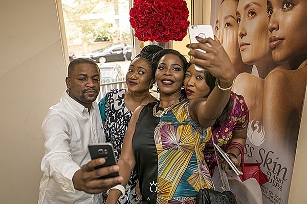 Group taking a selfie at an event.