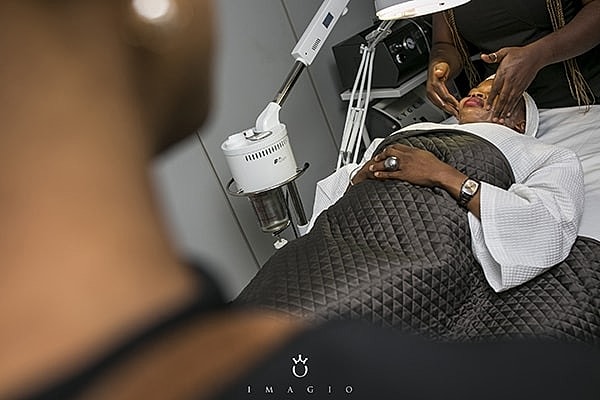 Woman receiving a facial treatment in spa.