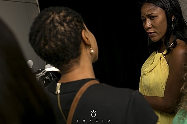 Two women engaged in serious conversation.