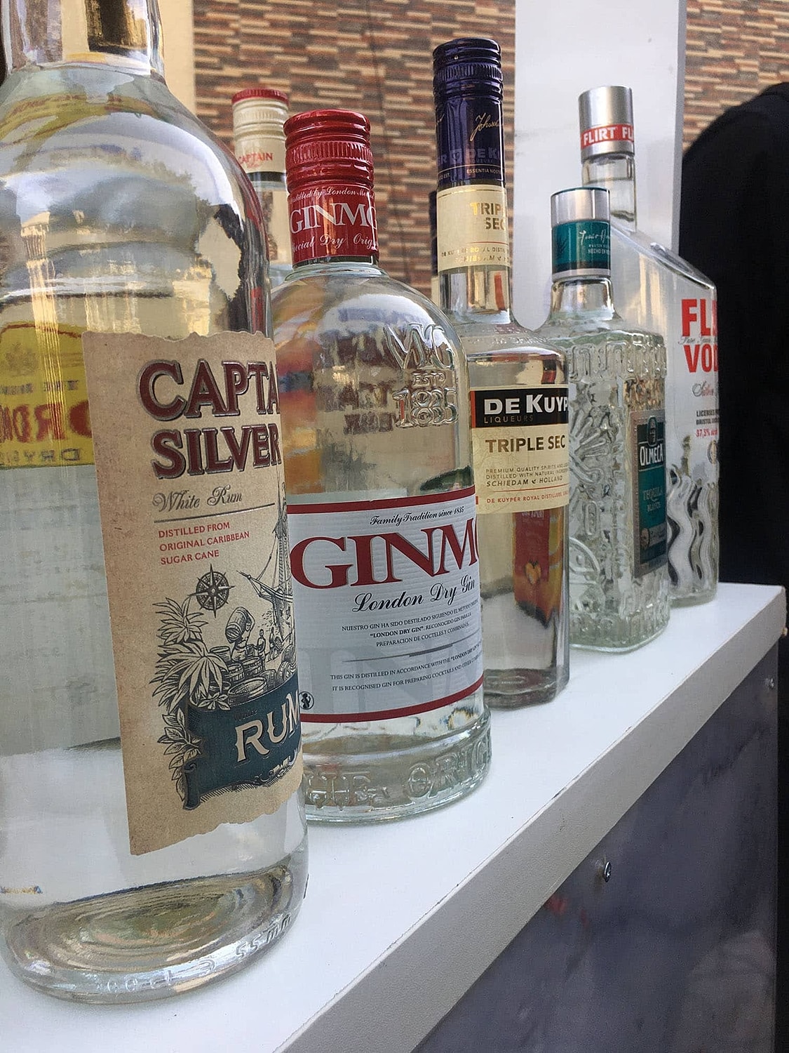 Assorted liquor bottles on display.