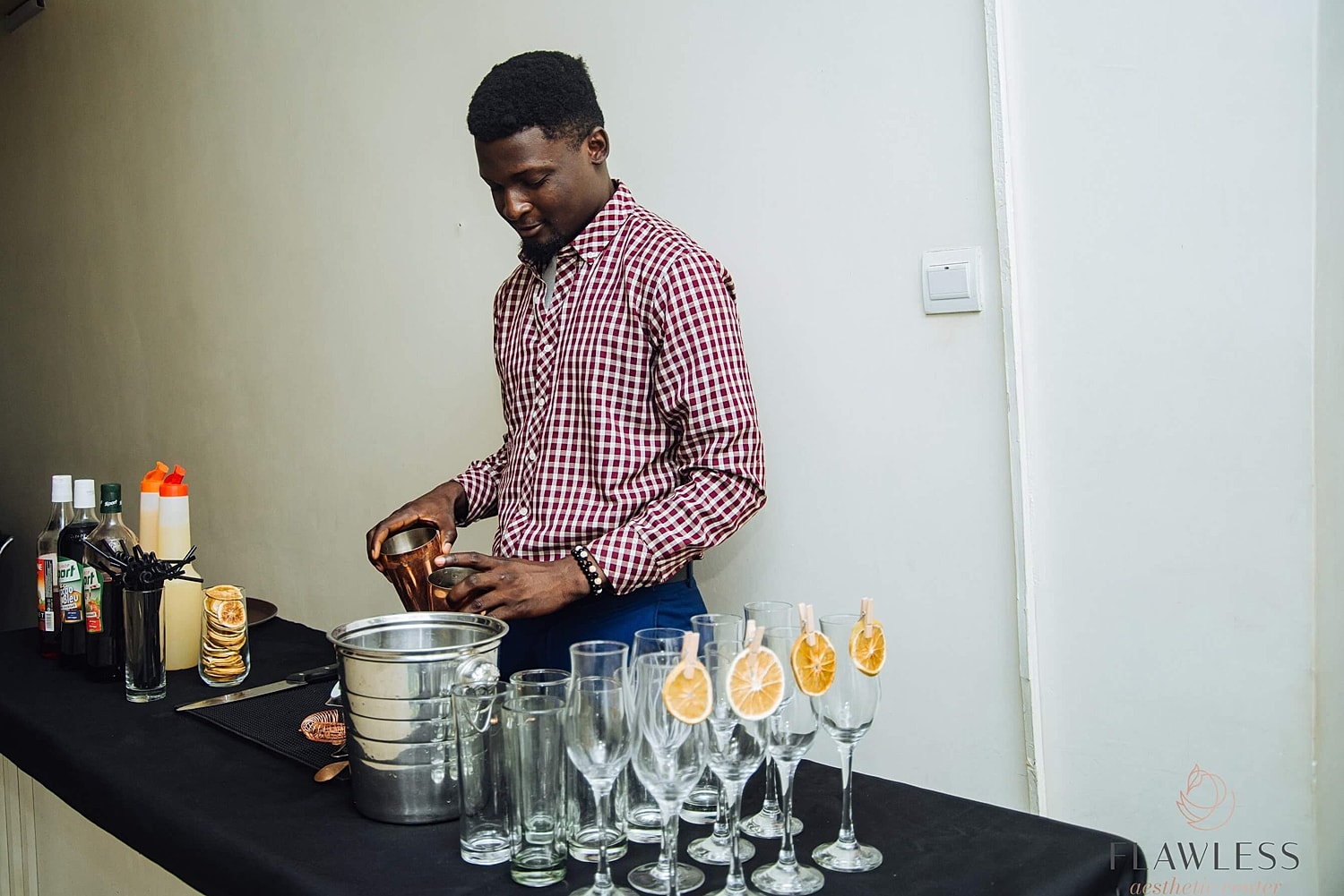 Bartender preparing drinks at a stylish event.