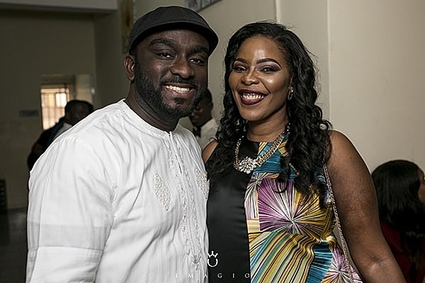 Smiling couple posing together indoors.