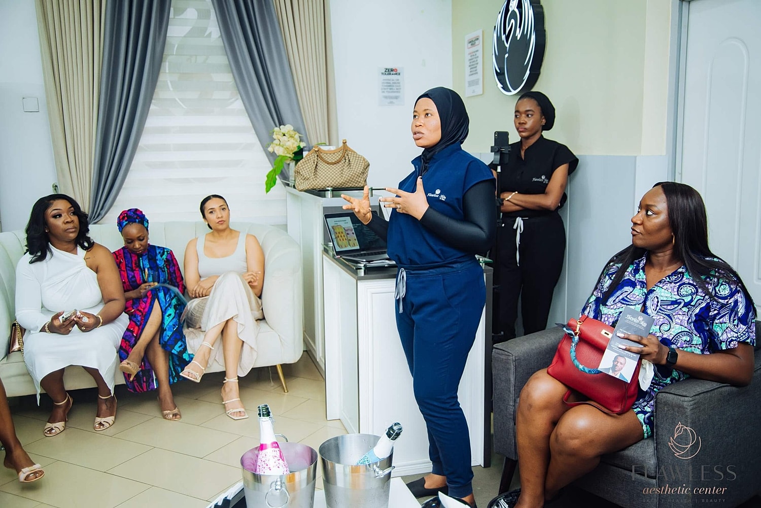 Group discussion at an aesthetic center event.