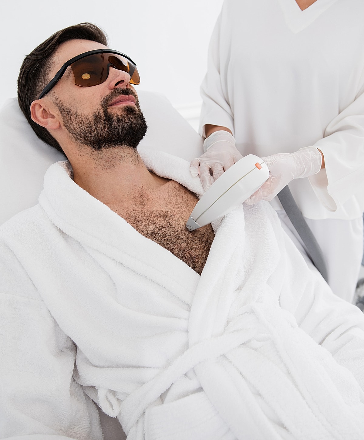 Man receiving chest laser hair removal treatment.