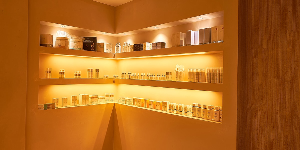 Shelves of various skincare products neatly arranged.