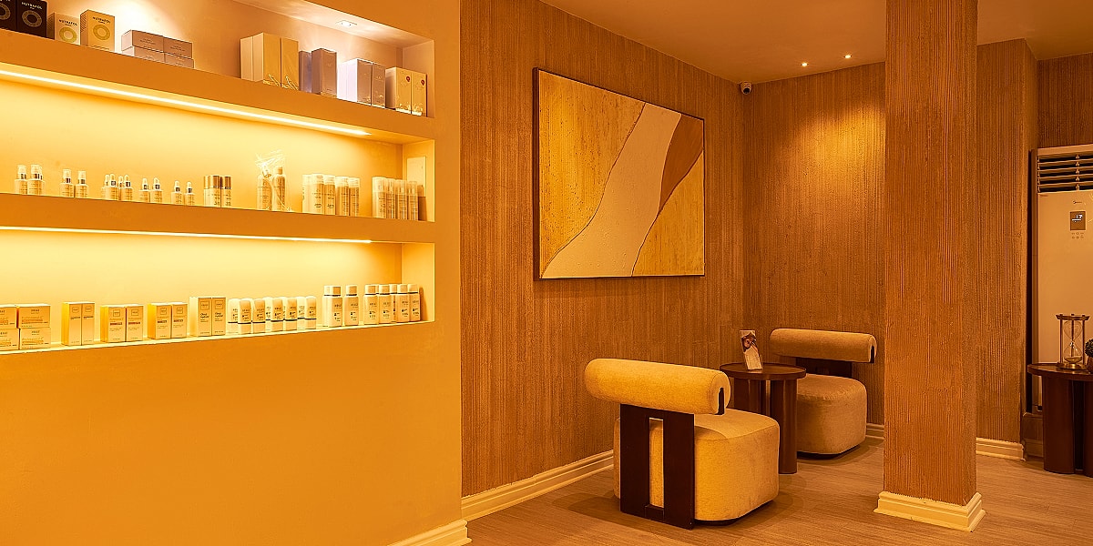 Stylish salon with skincare products and cozy seating.