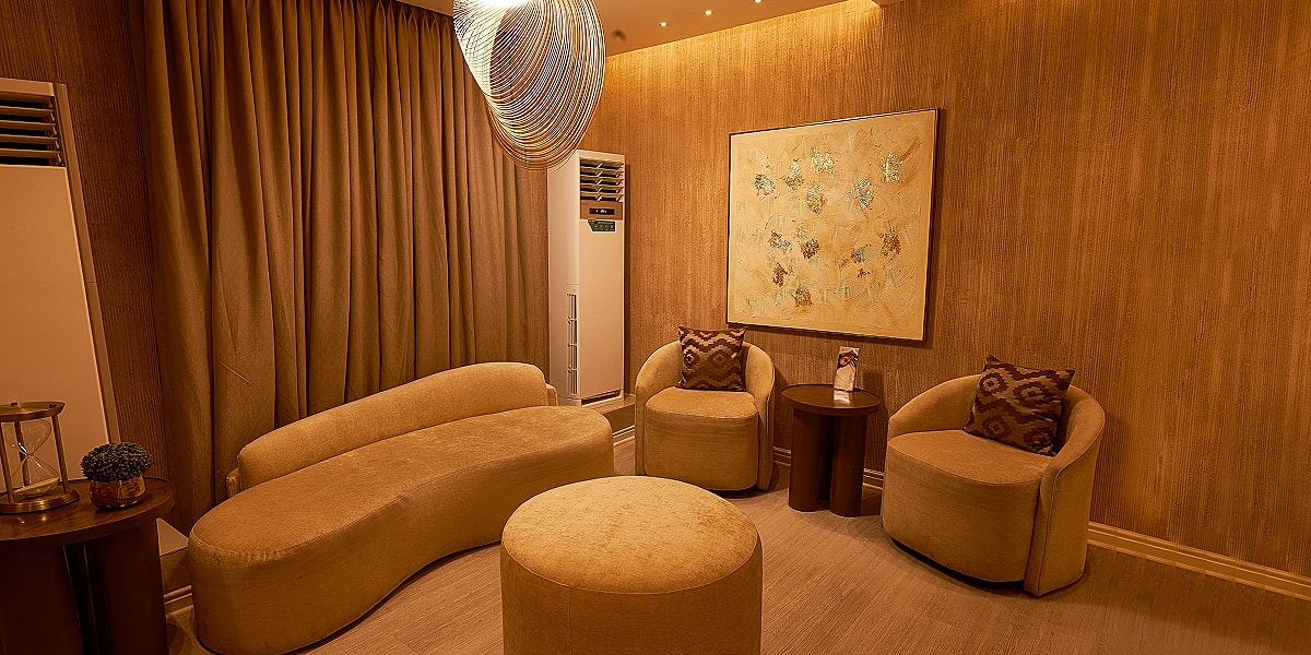 Cozy room with modern seating and warm lighting.