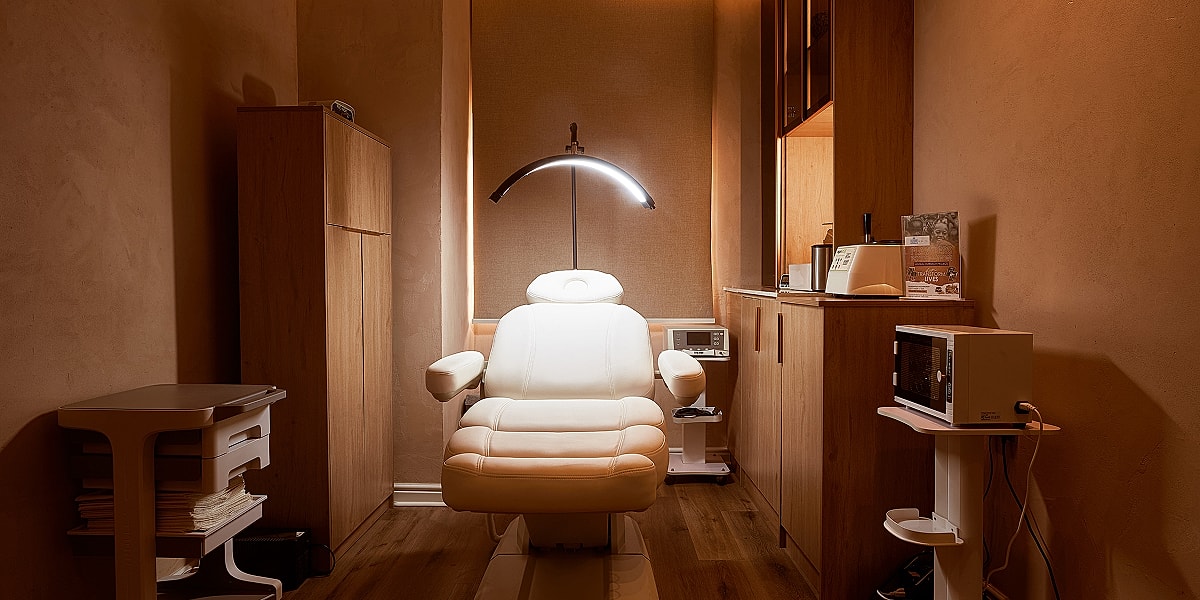 Cozy medical treatment room with a chair.