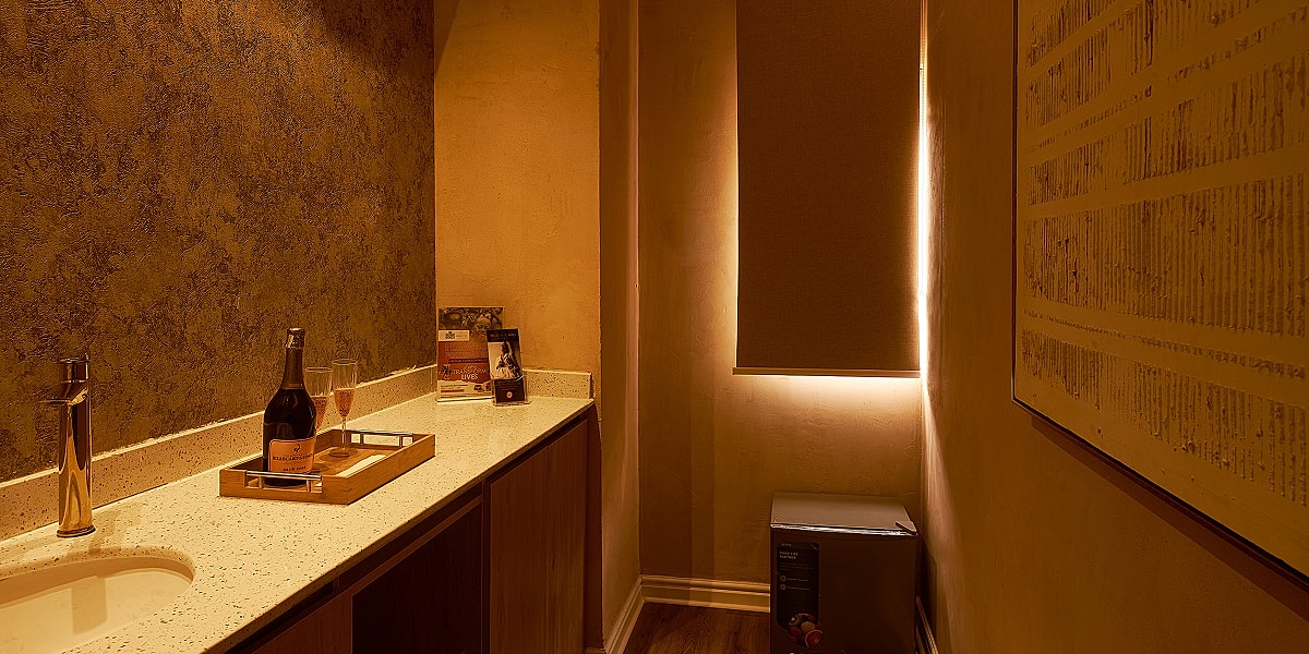 Cozy interior with wine and elegant decor.