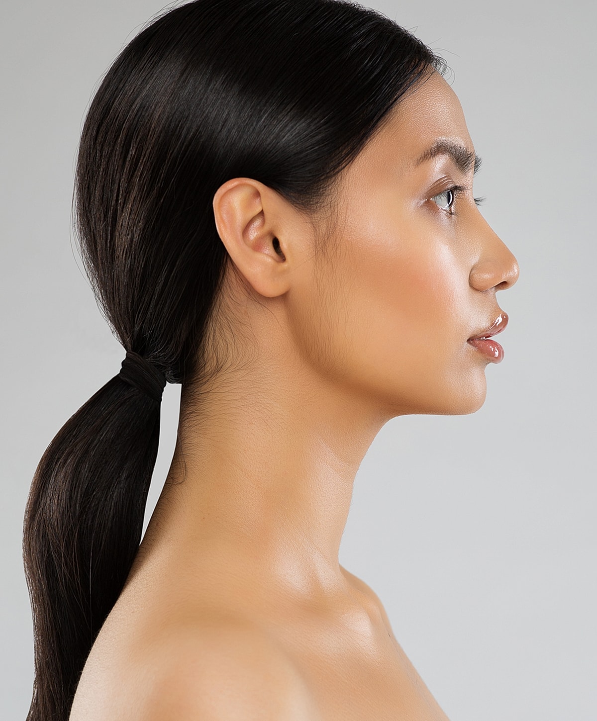 Abuja Facial Treatments model with long hair.