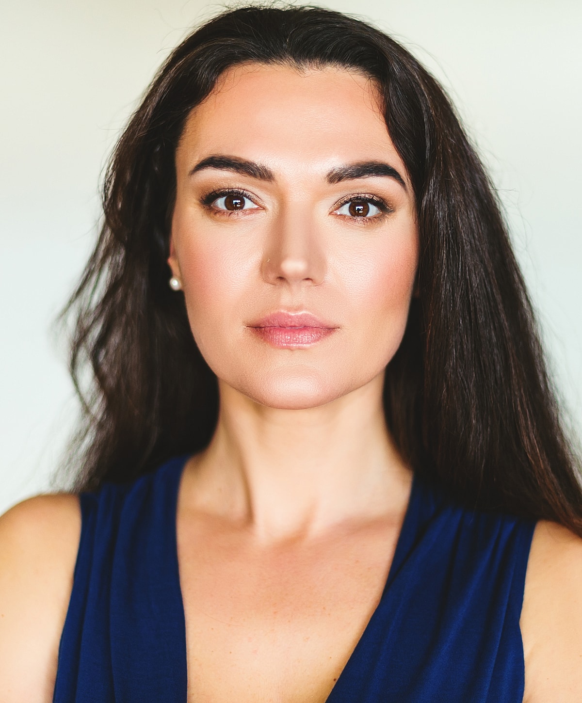 Abuja Hydrafacial model with long dark hair.