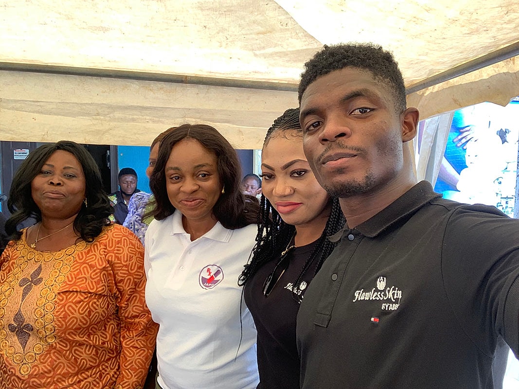 Group photo at an event, smiling faces.