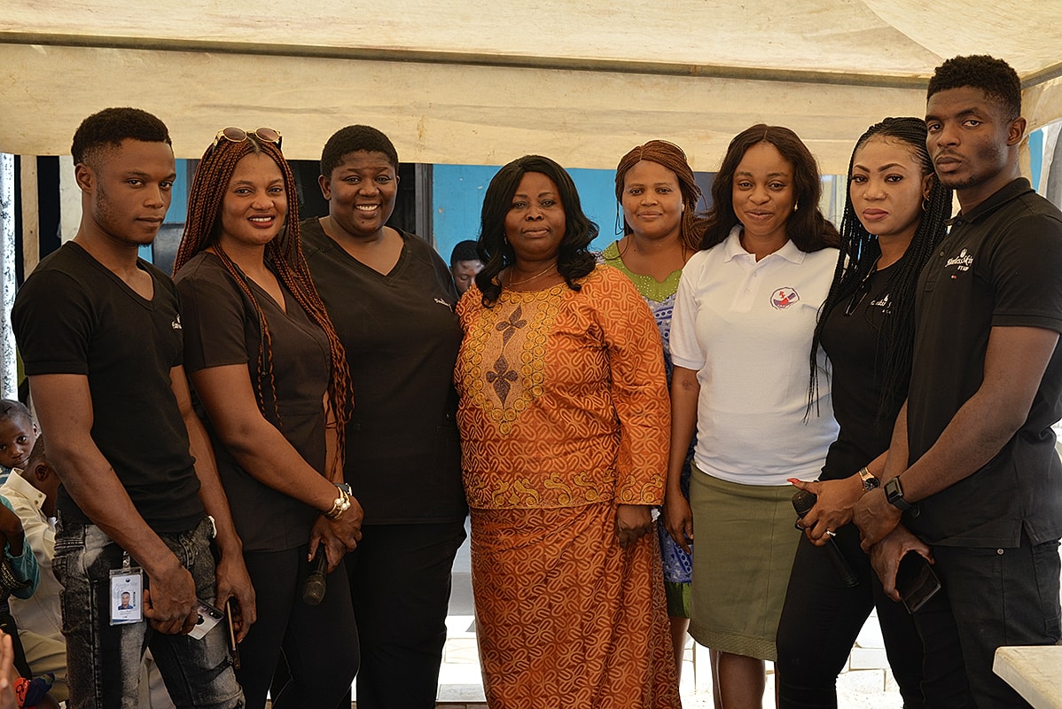 Group of people smiling at an event.