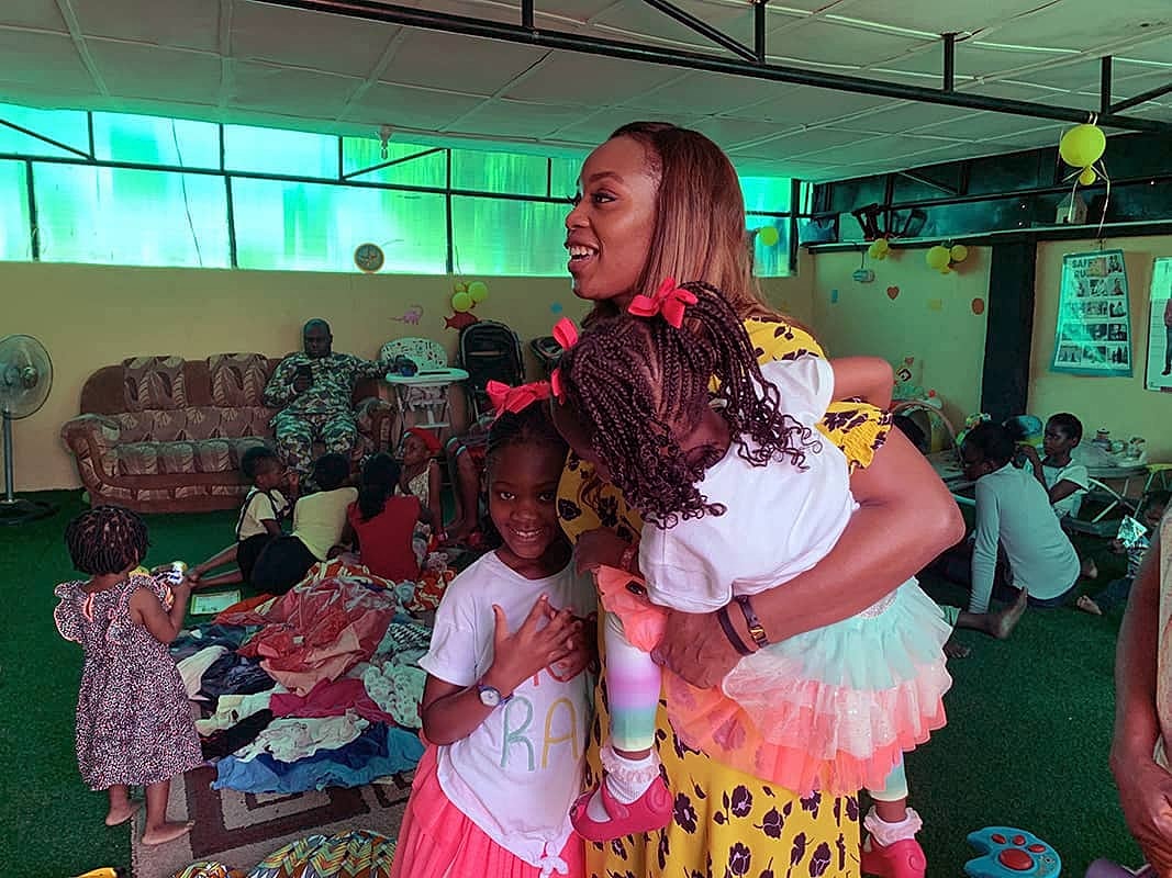 Children playing and interacting in a lively room.