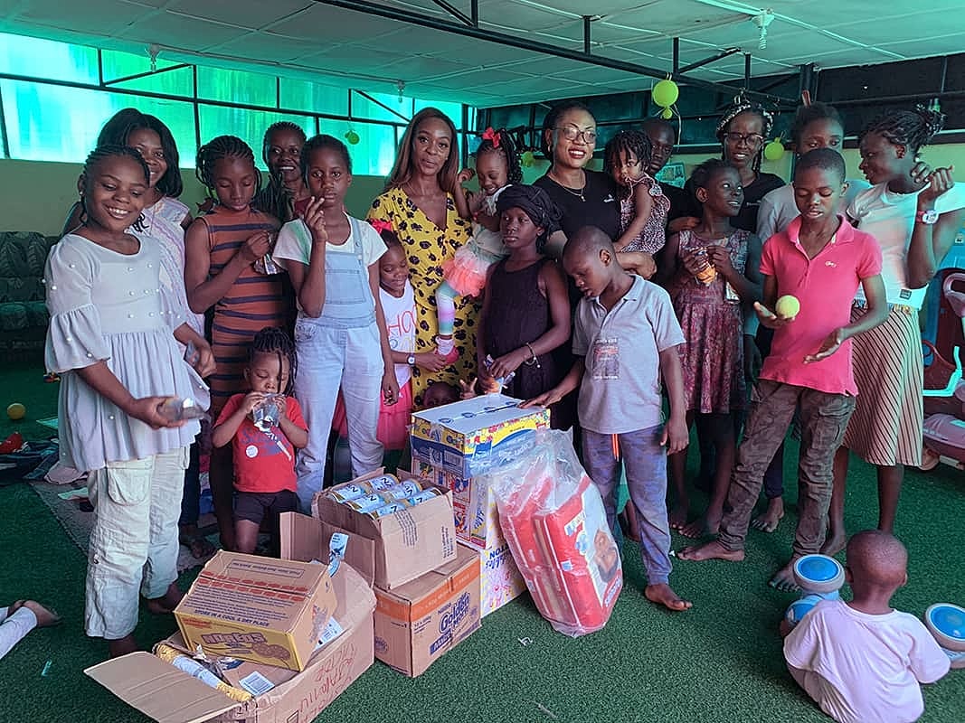 Group of children and adults celebrating together.