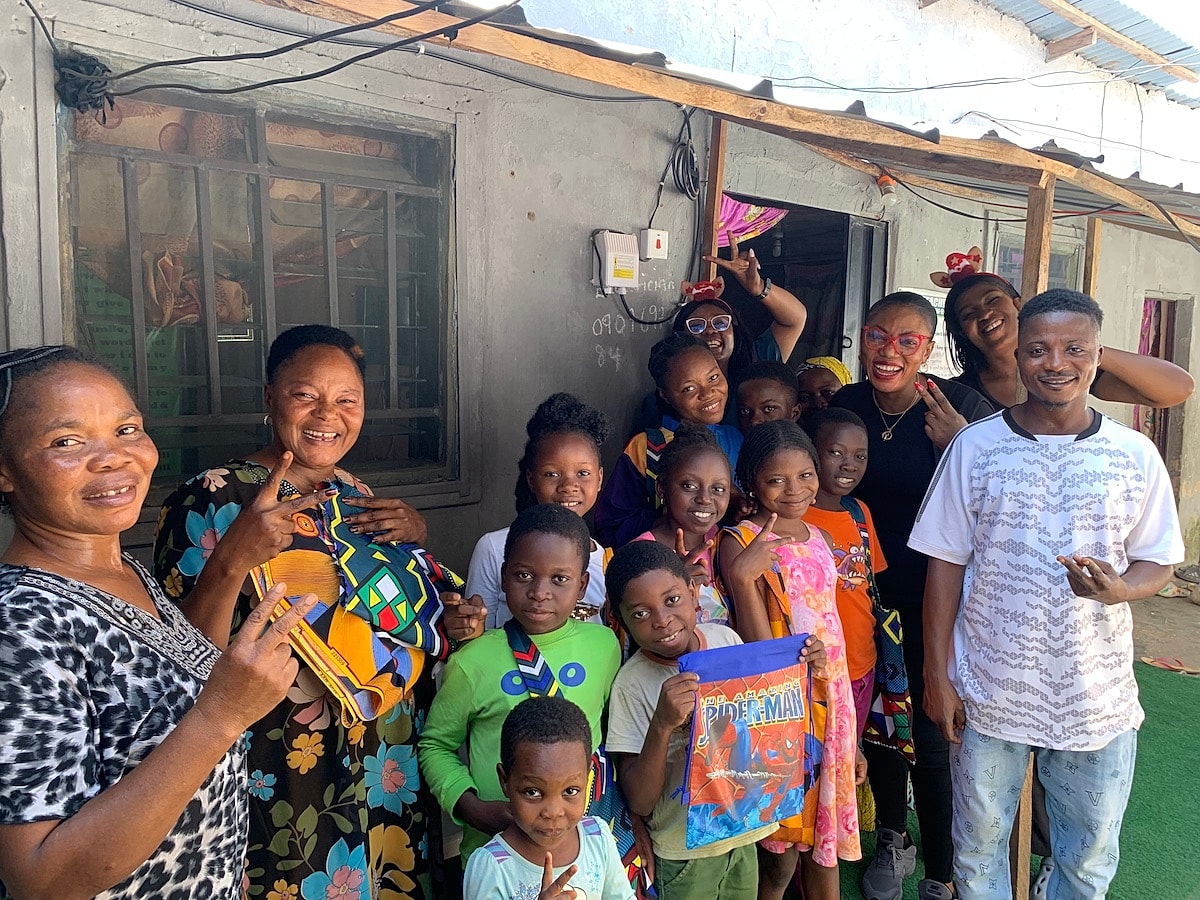 Celebration with children and adults in vibrant apparel.