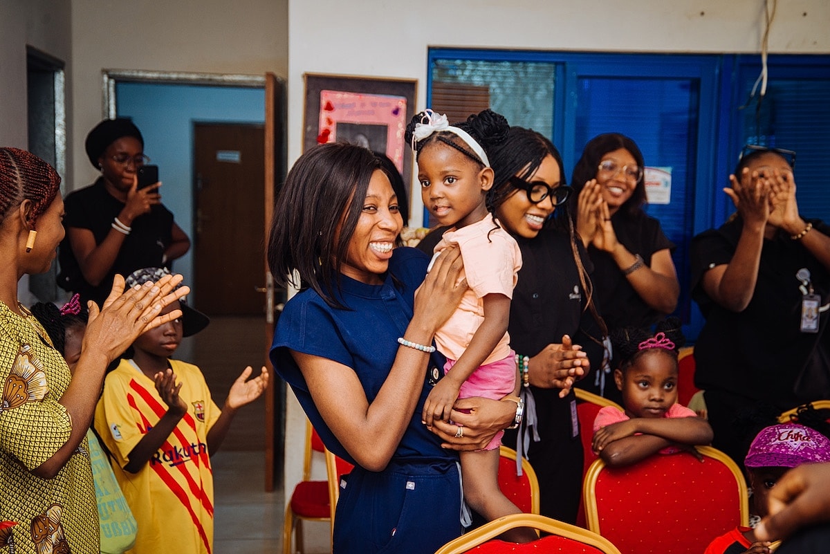 Celebration with women and children in gathering.