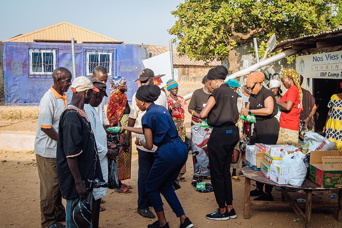 Community gathering for food distribution event.