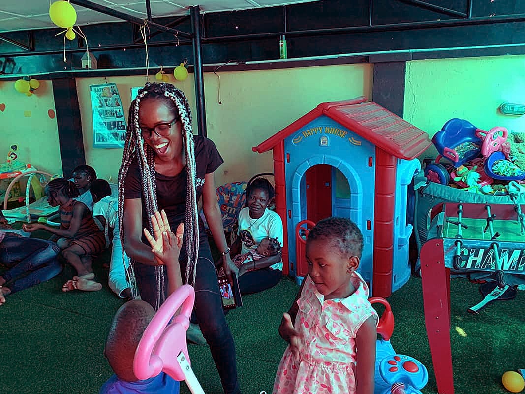 Children playing in a colorful indoor playground.
