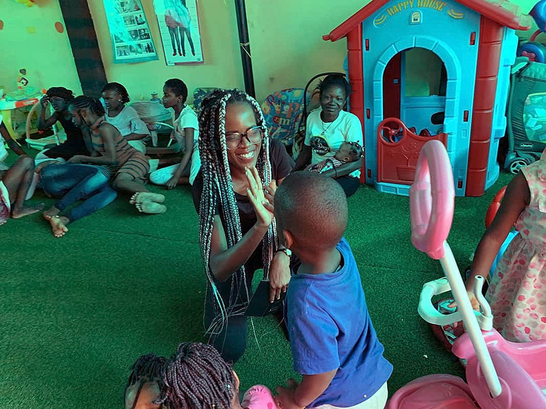 Children playing and interacting in a colorful space.