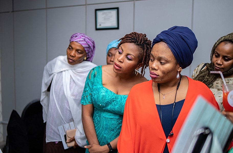 Group of women engaged in conversation or discussion.