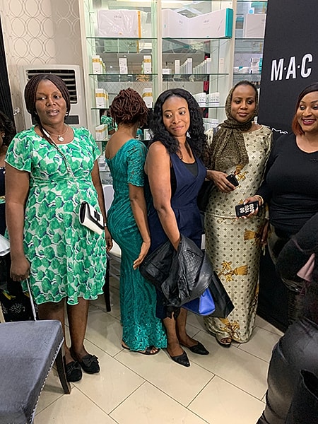 Group of women posing at an event.