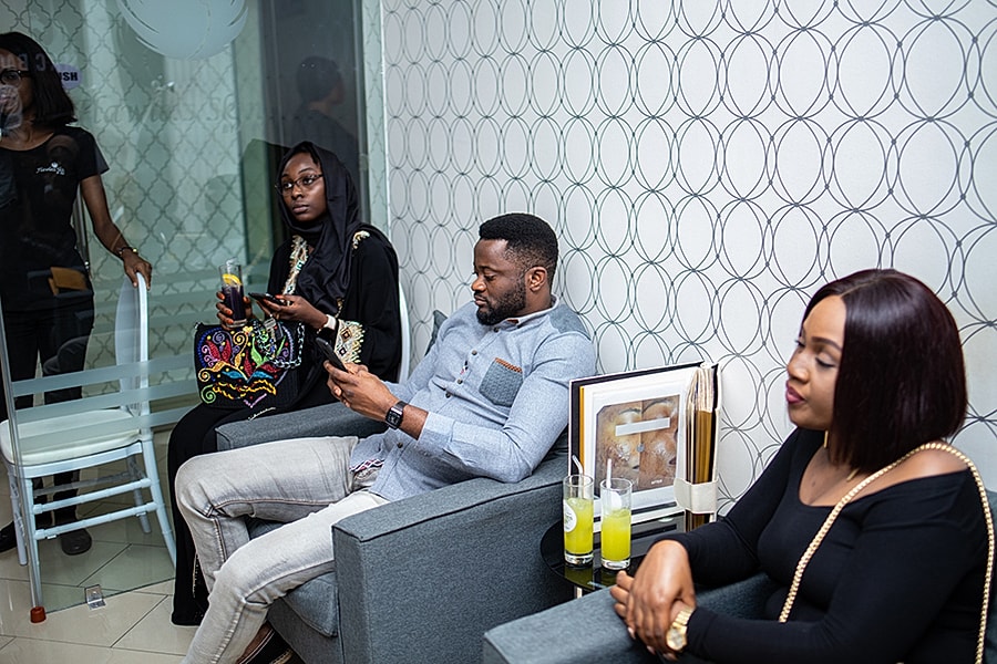 Group of friends relaxing in a modern lounge.