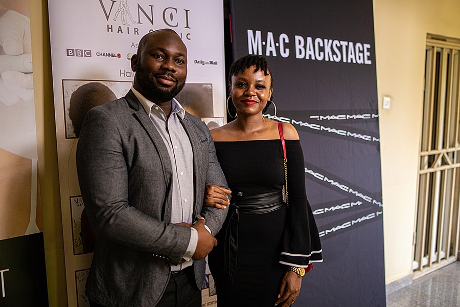 Woman posing with props at Flawless Skin event.