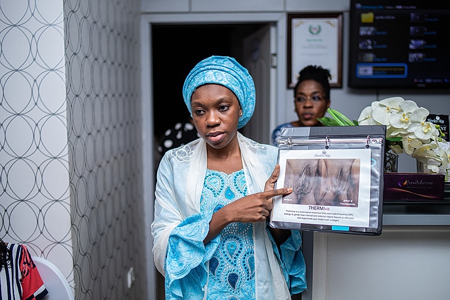 Woman presenting beauty treatment information.