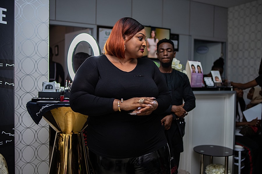 Beauty event with attendees interacting and posing.