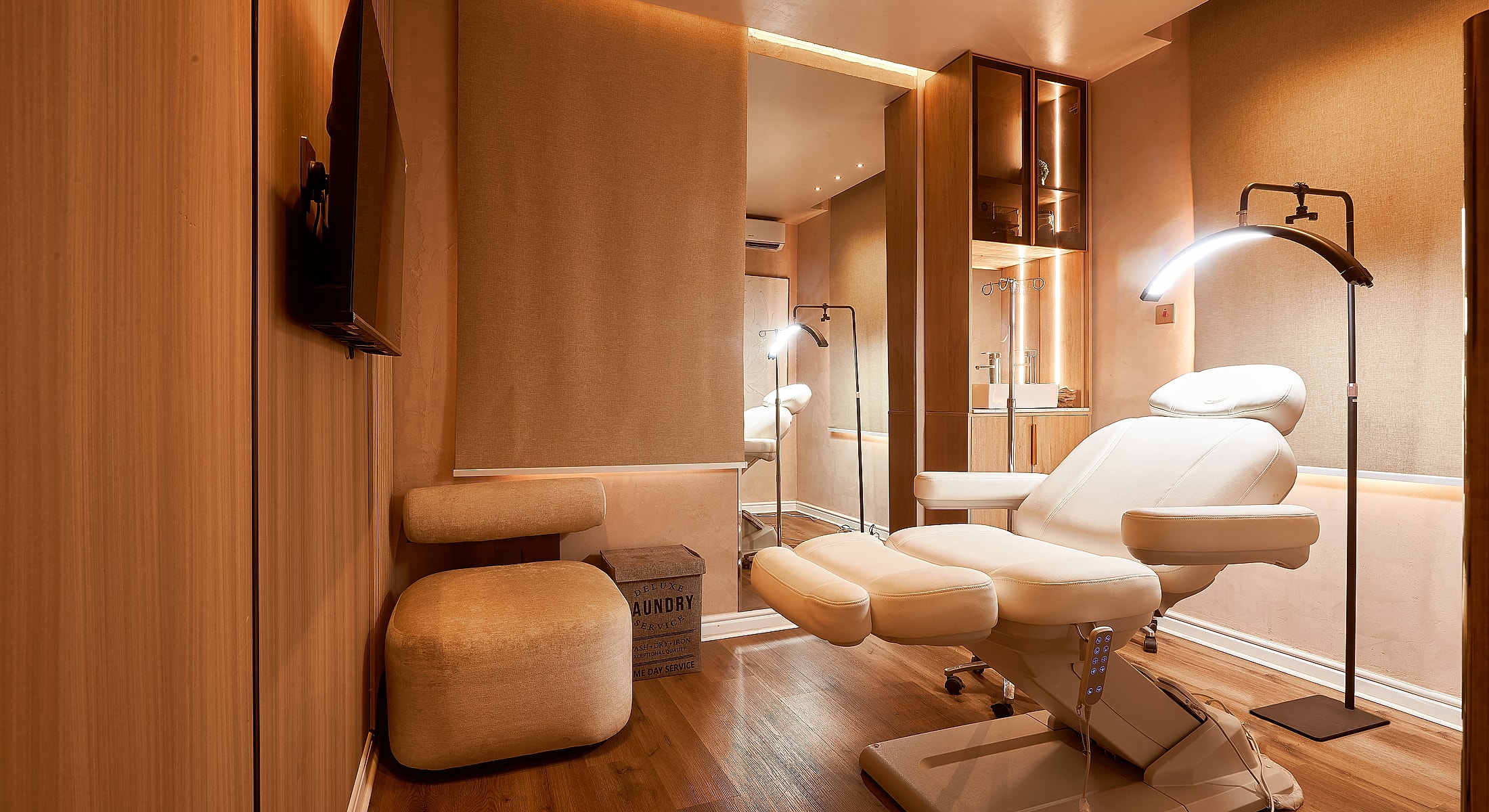 Modern spa treatment room with cozy furnishings.