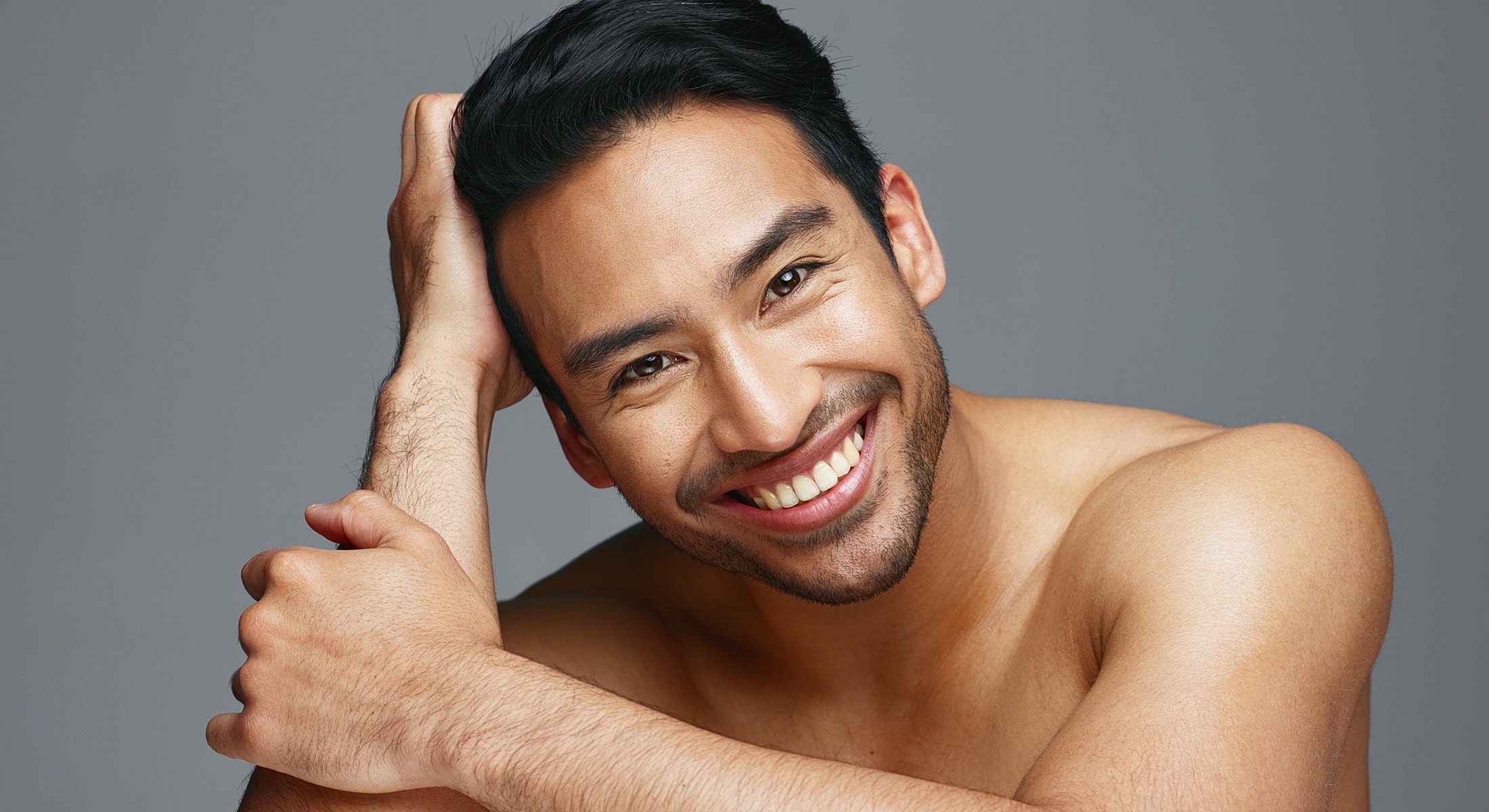 Abuja Kybella for Men model with short hair, casual pose.