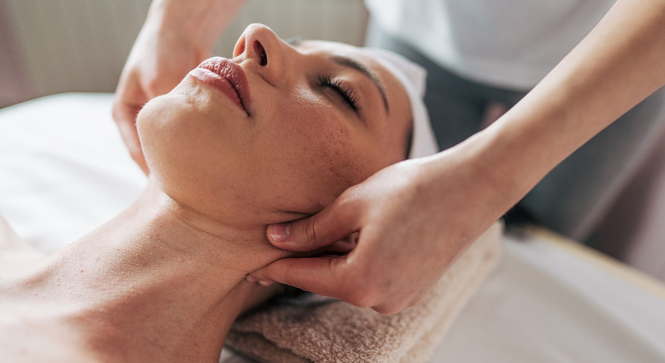 Abuja Facial massage treatment in a spa setting.
