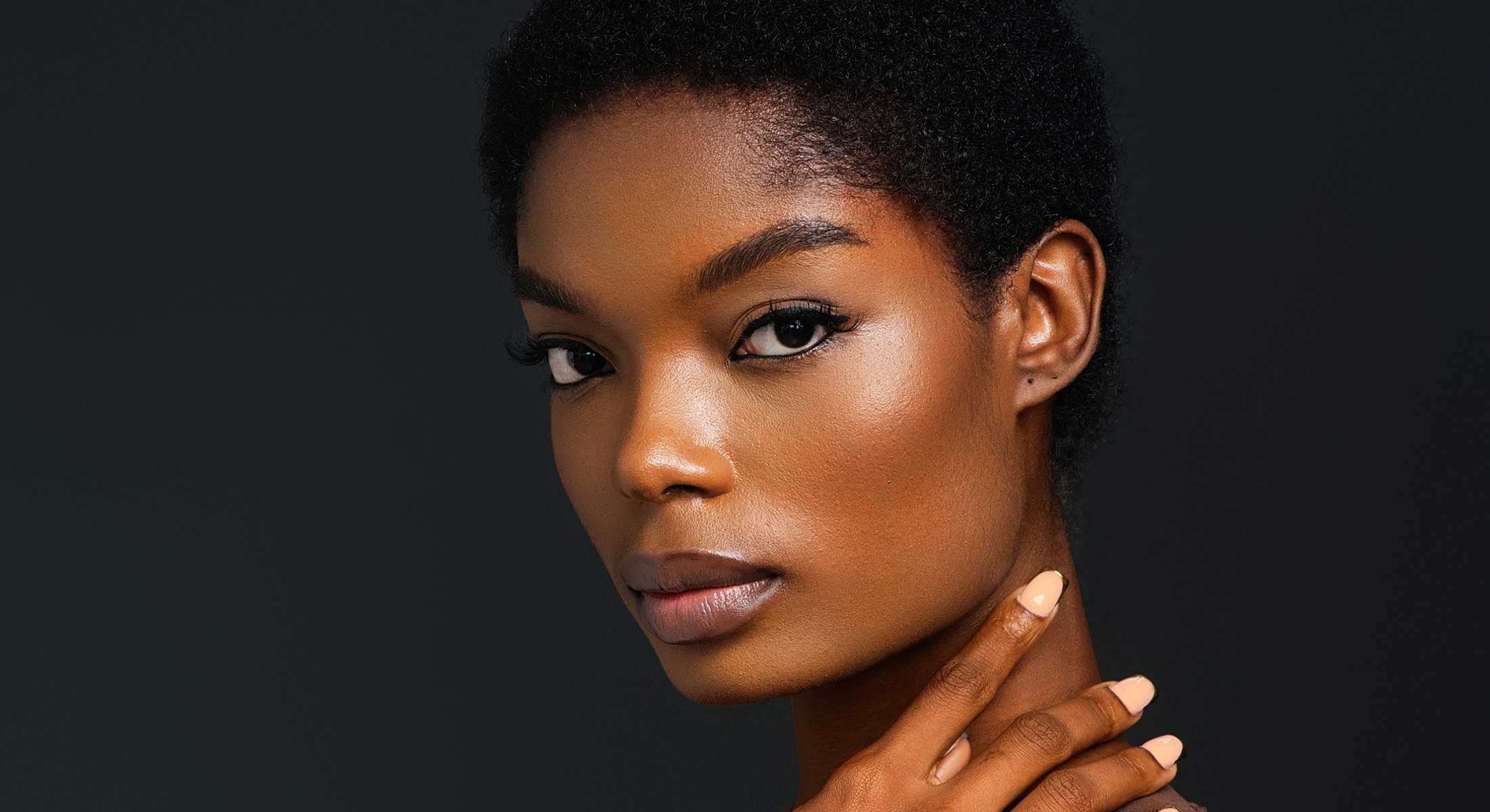 Abuja Hydrafacial model with short, natural hair.