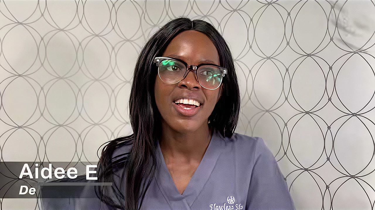 Professional woman speaking in a gray uniform.
